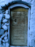 Wooden Door in Rubblestone Wall  Kalymnos  Greece
