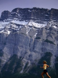 Woman Running in Front of Mountain  Banff  Canada