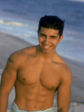 Portrait of Young Man with Out Shirt on the Beach