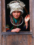 Shidong Miao Girl Wearing Silver Head Dress Looking Through a Window  Kaili  China