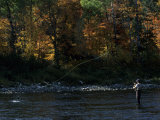 Fly-Fisherman Plays with an Atlantic Salmon on his Line