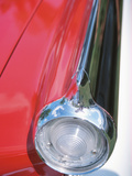 Sleek Tail Light on Antique Red Car