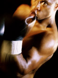 Close-up of a Male Boxer Wearing Boxing Gloves
