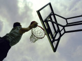 Low Angle View of a Man Shooting a Basket