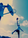 Low Angle View of Two Men Playing Basketball