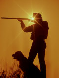 Silhouetted Hunter with Dog