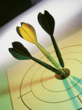 Close-up of Three Darts in the Bull's-Eye of a Dartboard