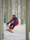 Snowboarder Maneuvering Through Trees