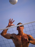 Young Man Playing Beach Volleyball