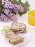 Elegant Sandwich and Juice with Blooming Purple Flowers