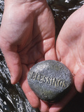 Person Holding Rock with the Word Blessings