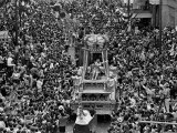 The Float Carrying Rex  King of Carnival  Squeezes Through a Massive Crowd