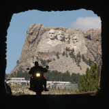 A Motorcyclist Rolls Through a Tunnel on Iron Mountain Road