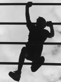 Boy Climbing on Jungle Gym