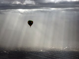 A Lone Balloon Drifts Near the Foothills of Albuquerque  NM