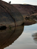 Two Venezuelan Fishermen Walk Along the Beach on the Orinoco River
