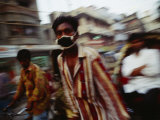 A Rickshaw Driver Wears a Mask to Keep Pollution Out of His Lungs in Dhaka