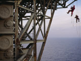 Remote Access Technicians Dangle off Ropes on an Oil Rig
