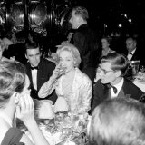 Marlene Dietrich with Yves St Laurant in Paris at Dinner Table in Restaurant  November 1959