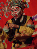 A Chinese Opera Performer in Monkey Makeup and Costume