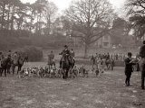 Hunting Men Riding Horses with a Pack of Hounds