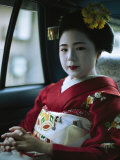 Kimono-Clad Geisha Sits in the Back of a Cab