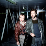 Phil Collins with Eric Clapton Leaving London Airport for Barbados  March 1984