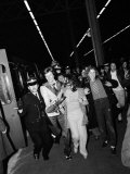 A Fan Grabs David Bowie as Police Hustle Him Through the Crowd of Rioting Teenyboppers  May 1973