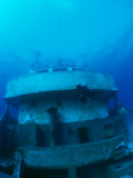 A Diver Exploring a Shipwreck