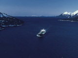 Oil Tanker Passes Through Valdez Narrows with Chugach Mountains