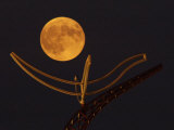 A Full Corn Moon Rises Above a Large Metal Sculpture on the Campus of the University of Minnesota
