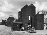 Clustered on the Shingle of the Old Town of Hastings Sussex are These Tall Black Huts