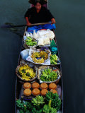 Woman Paddling Wooden Canoe Laden with Fruit for Sale at Floating Market  Damnoen Saduak  Thailand