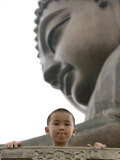 Young Boy in Front of Giant Buddha at Ngong Ping Plateau  China