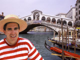 Gondolier by the Rialto Bridge  Venice  Italy
