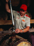 Taking Sample from Whisky Barrel at Makers Mark Distillery  Bardstown  United States of America