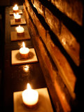 Lighted Candles and Brick Wall