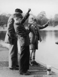 Boys in Their School Uniform Inspect Their Jam Jar Full of Little Fish
