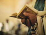 Man Holding a Prayer Book and Tefillin During a Synagogue Service  Israel