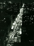 View of New York Illuminated at Night  Traffic Stretches for Miles as Cars Pour into the City