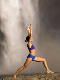Young Woman Practicing Yoga on a Rock  Snoqualmie Falls  Washington State  USA