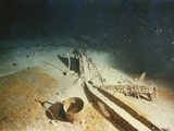 Cooking Pot from the Second-Class Galley and Twisted Metal Wreckage of the RM S 