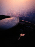 Overturned Kayak and Paddle Seen at Twilight