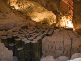 Barrels of Water and Crates of Food are Stored for Emergency in a Cave