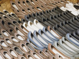 Pairs of Shoes at a Korean Market Resemble Dug-Out Canoes