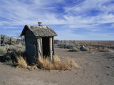 An Old Outhouse Leans with Age and Decay