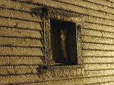 A Wall and Window of a Building Covered in Ice