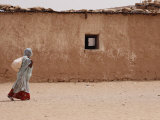 A Refugee from Western Sahara Leaves a Red Cross Food Distribution Center