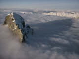 Aerial View of Mount Alberta Jutting up Through the Clouds