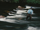 Water Flows Past a Fisherman Casting His Line